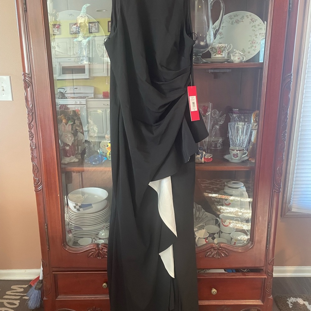 NWT Beautiful formal Gown. Asymmetrical Black dress with white ruffle.